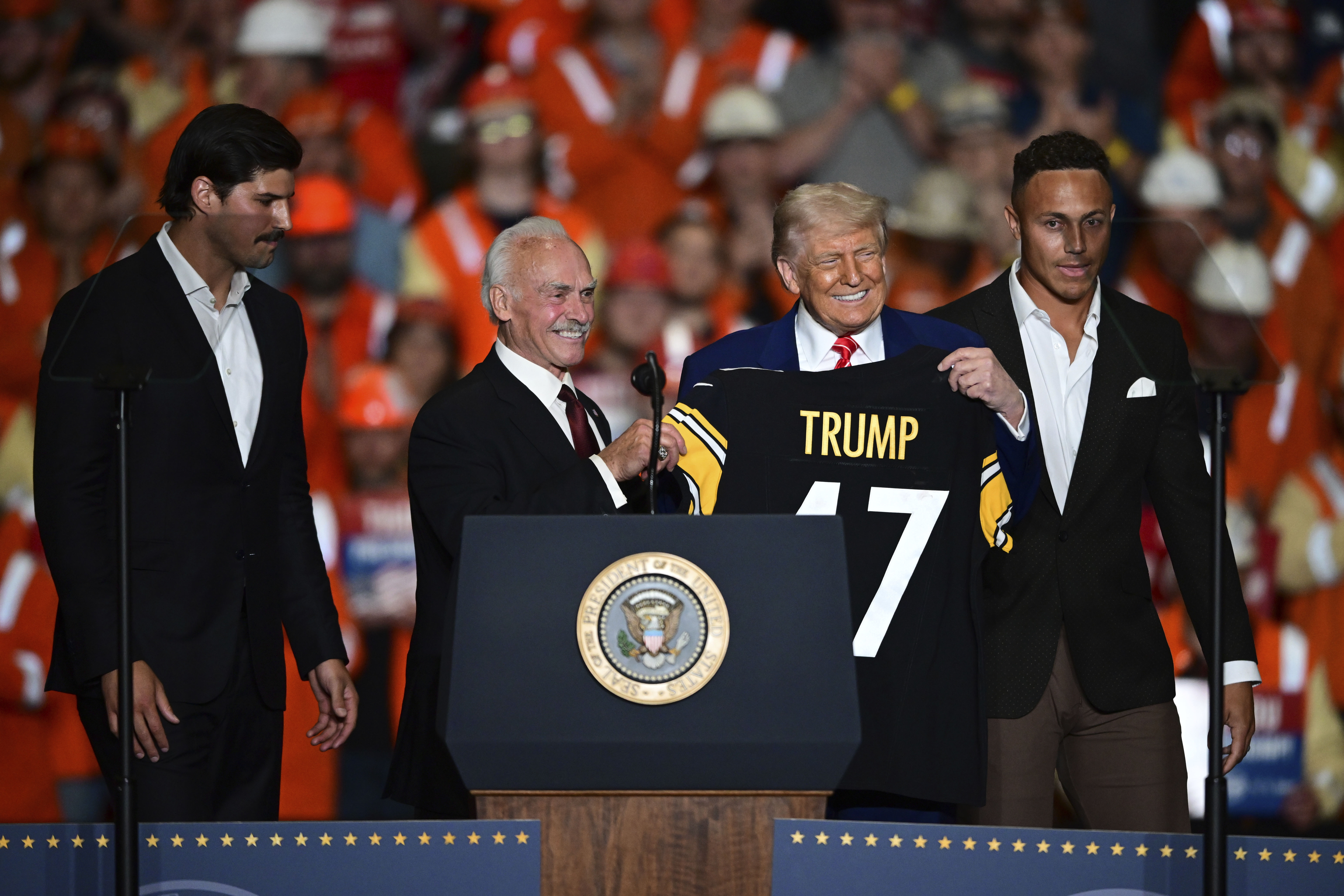 President Trump presented with a Pittsburgh Steelers jersey by three players.
